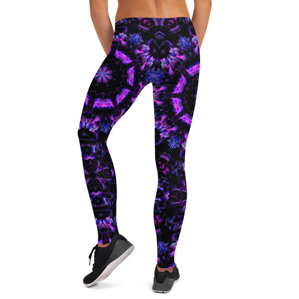 Photograph of a model wearing a unisex Bleace MetaParty Vibes Kaleidoscopic purple, blue, and pink, Trippy Visual leggings in the foreground with a white background