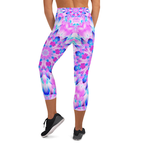 Product Photograph of a unisex Bleace MetaParty Vibes Kaleidoscopic blue, pink and white Trippy Visual yoga capri leggings in the foreground with a white background.