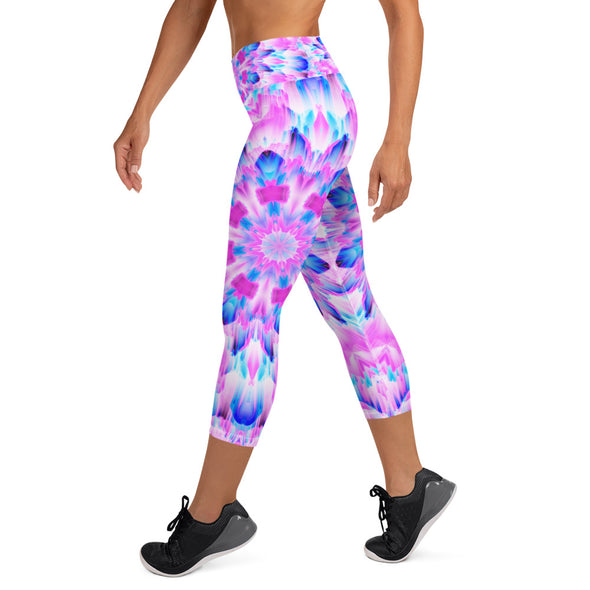 Product Photograph of a unisex Bleace MetaParty Vibes Kaleidoscopic blue, pink and white Trippy Visual yoga capri leggings in the foreground with a white background.