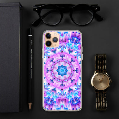 Product photograph of a Bleace Iphone case that has a kaleidoscope image made of pink, blue and purple colors in the foreground against a table backdrop next to a watch and eyeglasses.